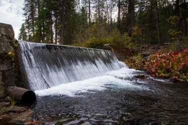 Lakin Dam near McCloud California, built in 1925 for domestic water supply for McCloud and for lumber mill boilers. clipart