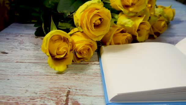 Bouquet Yellow Roses Lies Table Next Open Notebook Clean White — Stock Video