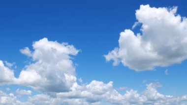 White cumulus clouds in a blue sky. Abstract dreams, tranquility, peace and fluidity of being