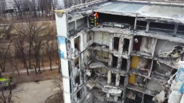 Kharkiv, Ukraine - January, 25, 2023: A multi-storey apartment building in a Ukrainian city destroyed by a Russian missile strike. Destroyed entrance of a panel house. Shooting from a drone, flying