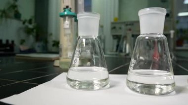 Flasks with liquid in a chemical laboratory. Laboratory water analysis