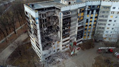 Kharkiv, Ukraine - January, 25, 2023: A nine-story apartment building in a Ukrainian city destroyed by a Russian missile strike. Instead of a porch and apartments a hole, concrete slabs of walls fell