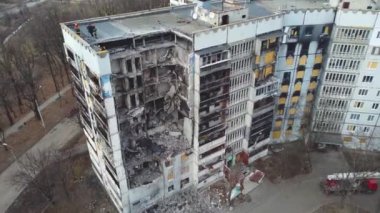 Kharkiv, Ukraine - January, 25, 2023: A nine-story apartment building in a Ukrainian city destroyed by a Russian missile strike. Instead of a porch and apartments a hole, concrete slabs of walls fell