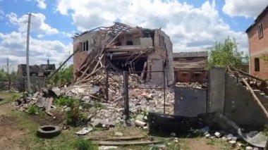 Destroyed by shelling from heavy artillery, a house in the village. The real war between Ukraine and Russia