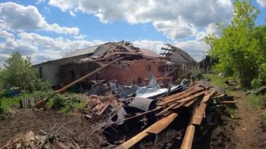 War-torn one-story house in the village. War in Ukraine. Consequences of shelling with heavy weapons