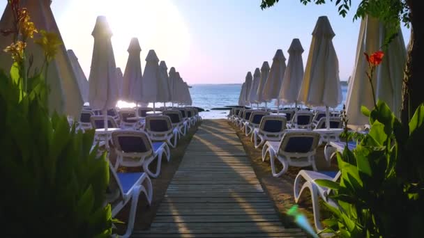 Folded Beach Umbrellas Sun Loungers Evening Beach Sea Sunset Sea — Stock Video
