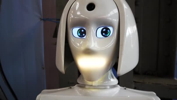 White Robot Talks Turns Its Head Rotates Its Eyes Artificial — Stock Video