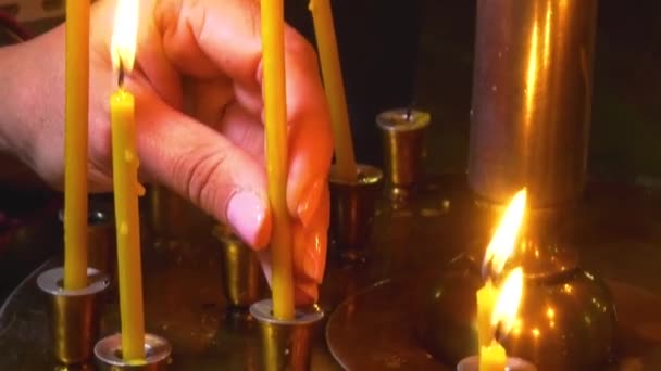 Womans Hand Places Burning Candle Candlestick Cross Church Prayers Spiritual — Stock Video