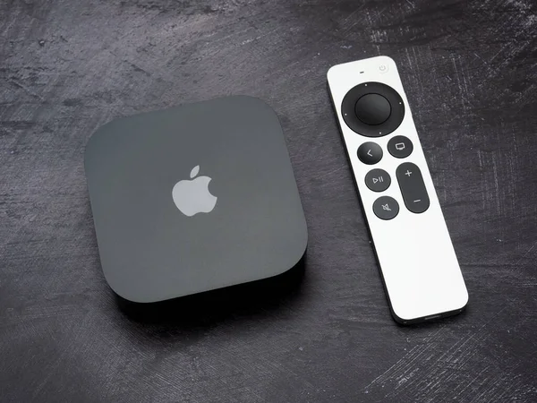 stock image Bucharest, Romania - December 4, 2022: Product shot of the Apple TV 4k 2022 with WiFi and Ethernet, 128Gb RAM, and with Siri Remote, on gray background