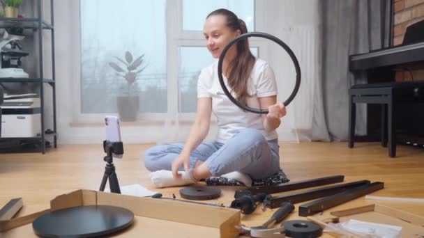Girl Shows Parts Tools Laid Out Floor Front Her Set — Stock Video