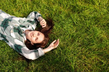 woman smiling on grass top view