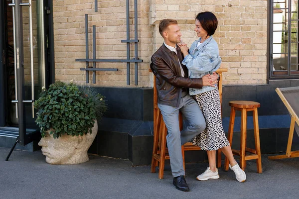 stock image Loving woman hugging man while couple walking in city