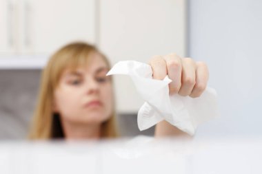 woman wipes the surface with a napkin close-up