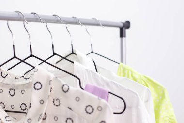 hanger with clothes on the crossbar close-up