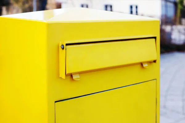 stock image close-up yellow mailbox for letters and newspapers