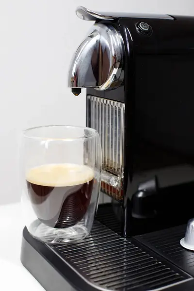 Morning coffee in capsule. Espresso machine front view