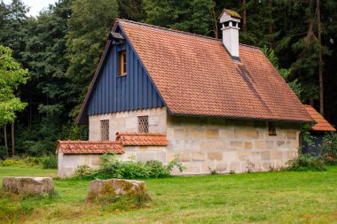 stone house near the forest. forester's house in Europe clipart