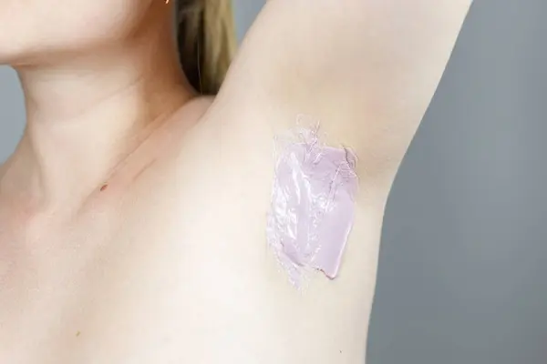 stock image woman waxing armpits by herself close up