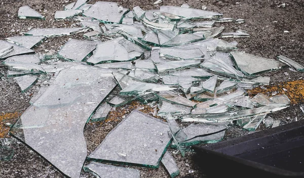 Stock image Glass is broken into pieces on the cement floor