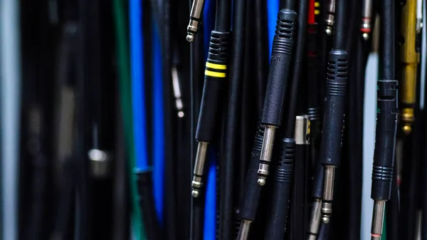 colorful audio cables on black background