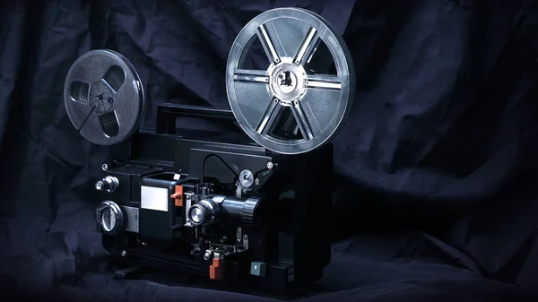 8 mm movie projector on dark background