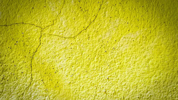 stock image Old cement background with yellow cracks.