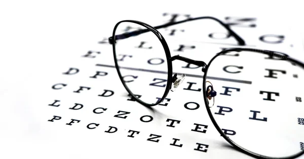 Óculos Pretos Gráfico Teste Olho Fundo Branco — Fotografia de Stock