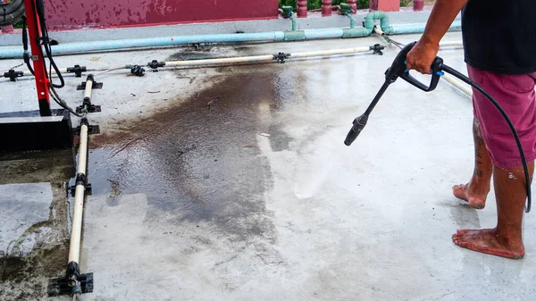 Clean the cement floor with a high-pressure cleaner. Deck floor