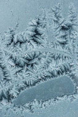 Abstract background with decorative ice crystals pattern on black matte background