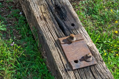 One old railway sleeper with a metal plate carrying the rail.