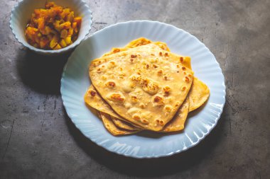 Indian food paratha made of wheat flour white potato curry.   clipart