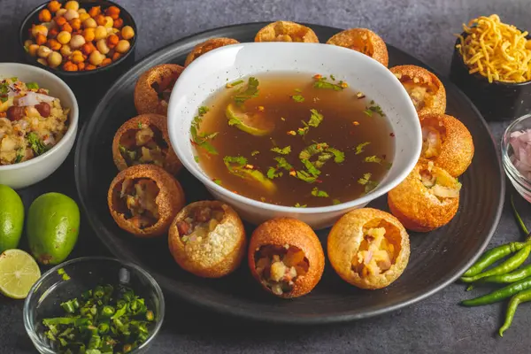 Stock image Exploring the Tangy, Spicy, and Refreshing Delight of Pani Puri. India's Favourite Street Food Experience. Selective focus. 