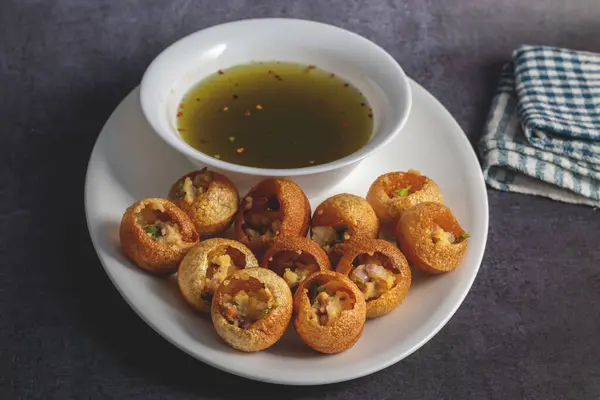 Stock image Exploring the Tangy, Spicy, and Refreshing Delight of Pani Puri. India's Favourite Street Food Experience. Selective focus. 