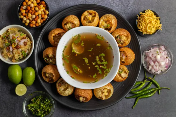 stock image Exploring the Tangy, Spicy, and Refreshing Delight of Pani Puri. India's Favourite Street Food Experience. Selective focus. 