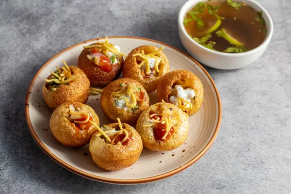 stock image Exploring the Tangy, Spicy, and Refreshing Delight of Pani Puri. India's Favourite Street Food Experience. Selective focus. 