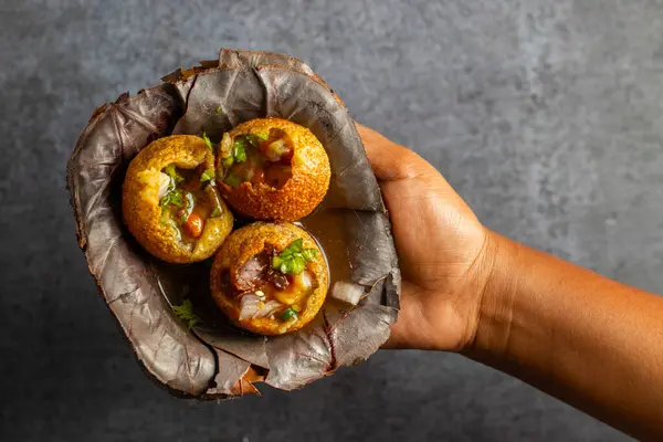 Stock image Exploring the Tangy, Spicy, and Refreshing Delight of Pani Puri. India's Favourite Street Food Experience. Selective focus. 