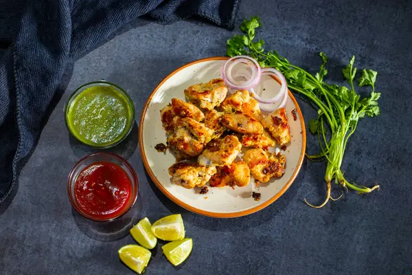 stock image selective focus of Indian Mughal Cuisine Chicken Reshmi Kabab or Malai Kabab, Serve With Mint and Tomato Chutney.