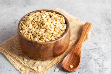 selective focus of watermelon seeds on an wooden bowl, for healthy brain and body.  clipart