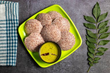 Ragi idli is a healthy, steamed South Indian dish made from fermented ragi (finger millet) batter, soft, and nutritious. clipart