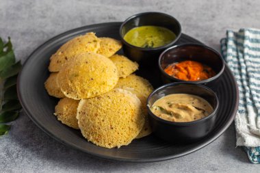 Oats Idli is a healthy, steamed South Indian breakfast made with oats, semolina, yogurt, and spices, offering a nutritious twist. Selective focus. clipart