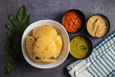 Oats Idli is a healthy, steamed South Indian breakfast made with oats, semolina, yogurt, and spices, offering a nutritious twist. Selective focus. clipart