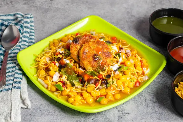 stock image Aloo tikki is a popular Indian snack made from spiced mashed potatoes, formed into patties, and fried until crispy.