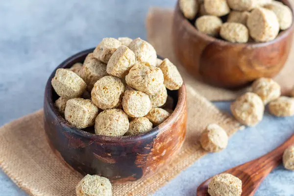 stock image Raw soya chunks are dehydrated, protein-rich, plant-based meat substitutes made from defatted soy flour, commonly used in vegetarian dishes.