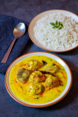 Delicious Tangy Kadi Chawal: Spiced Yogurt Curry with Rice, A Comforting North Indian Traditional Meal clipart