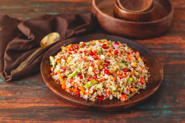 A refreshing quinoa salad with fresh vegetables, herbs, lemon dressing, and a light, nutty flavor, perfect for healthy meals. clipart