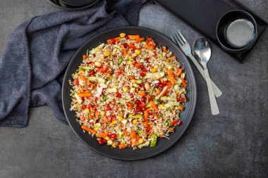 A refreshing quinoa salad with fresh vegetables, herbs, lemon dressing, and a light, nutty flavor, perfect for healthy meals. clipart