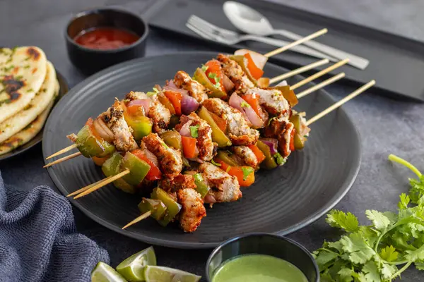 stock image Chicken Reshmi Kabab is a succulent, marinated chicken skewer, grilled to perfection, featuring rich spices, creamy yogurt, and aromatic herbs.