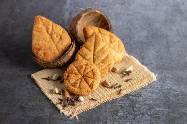 Thekua is a traditional sweet made with wheat flour, jaggery, and ghee, often prepared during Chhath Puja in Uttar Pradesh and Bihar as an offering. clipart