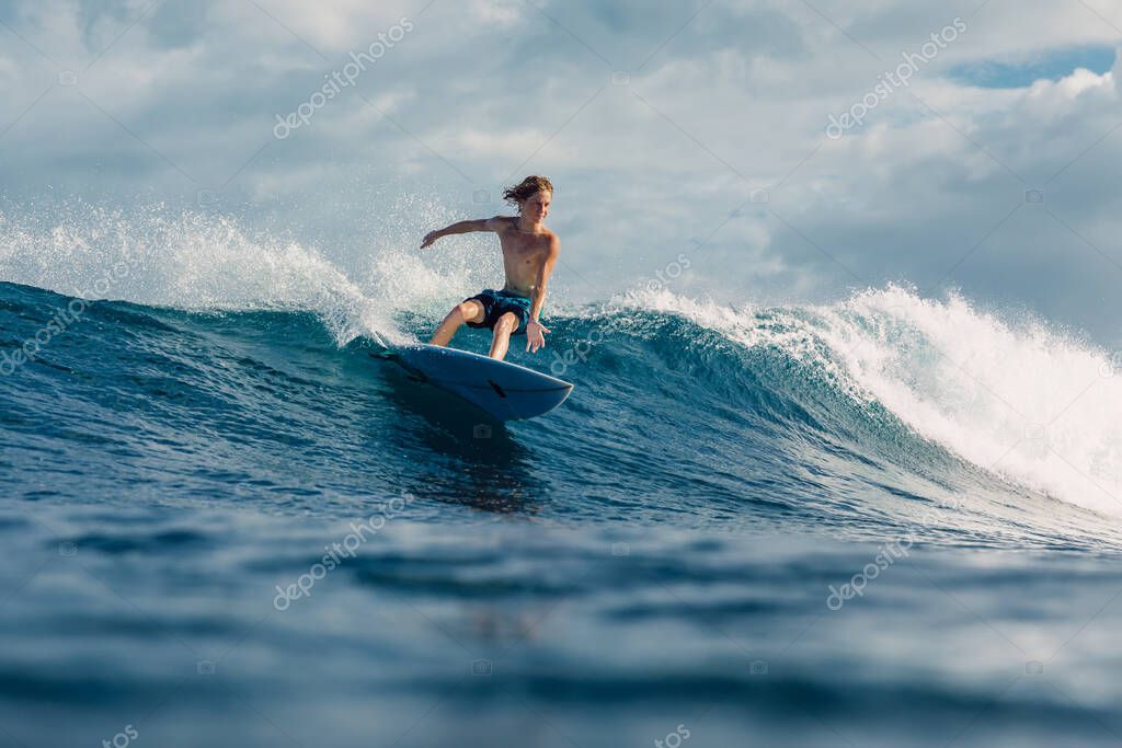 January 4, 2023. Bali, Indonesia. Teenager in tropical ocean during