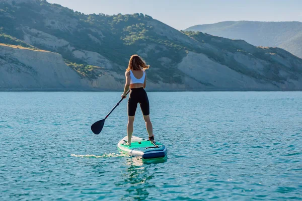 Slim Woman Rowing Stand Paddle Board Quiet Sea Mountain Landscape — Fotografia de Stock